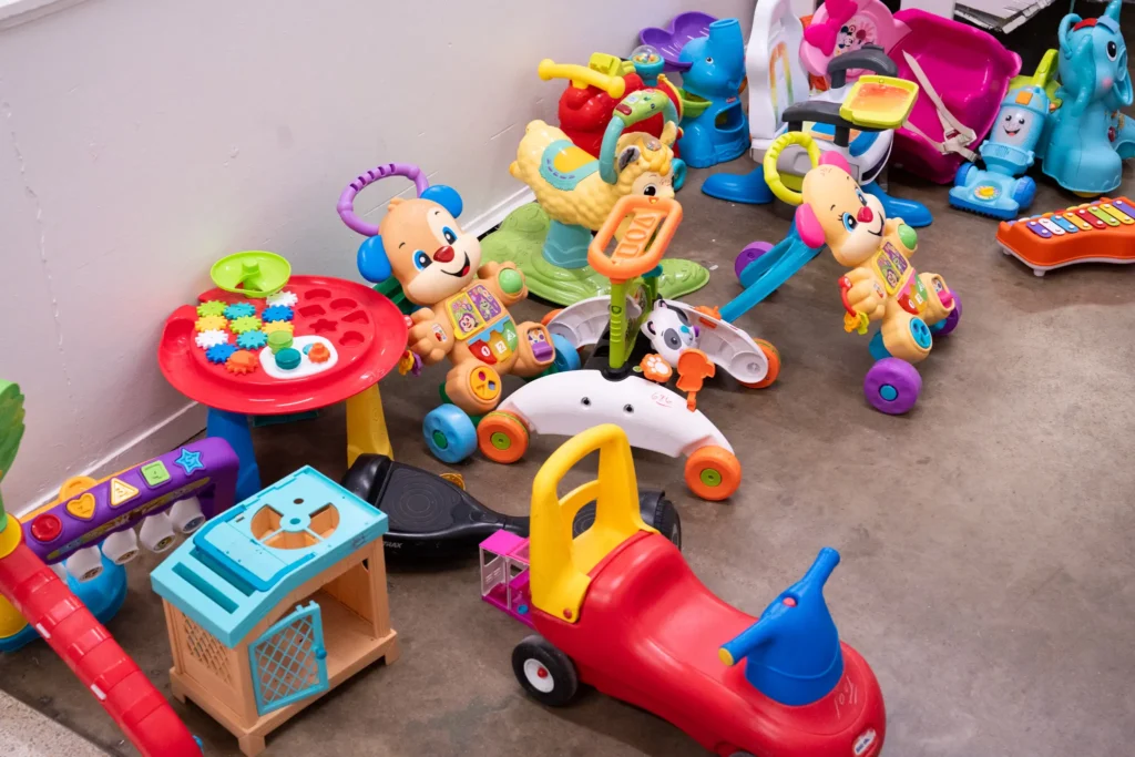 Assorted children’s ride-on toys, learning toys, and colorful playsets at the Jensen location.