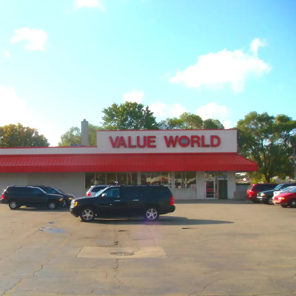 Exterior of the Value World store in Clinton Township, Michigan, showing the storefront entrance and parking lot.