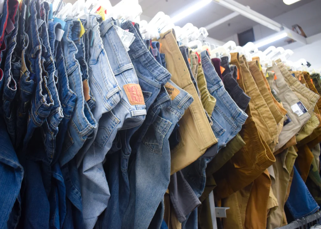 Jeans, shirts, and shoes displayed inside Value World.