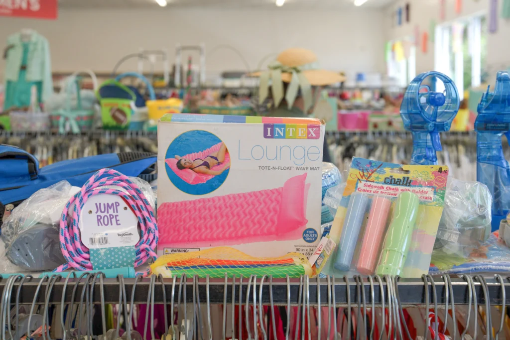 Jump ropes, sidewalk chalk, pool floats, and other outdoor toys displayed at Value World.