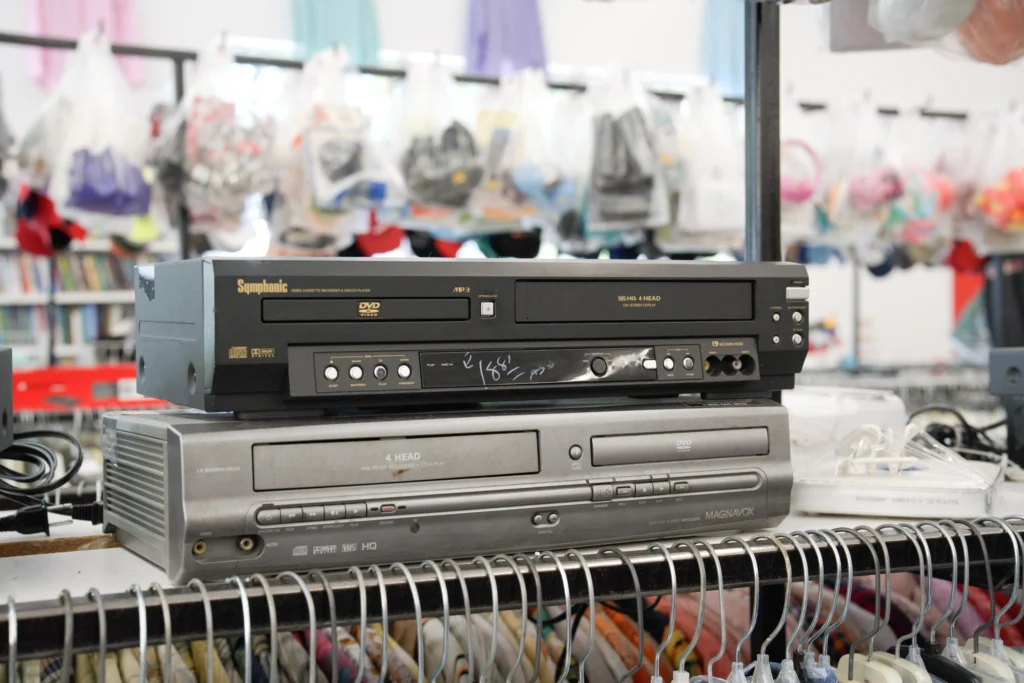 DVD and VHS combination players displayed in the electronics section of the Value World The Heights store.